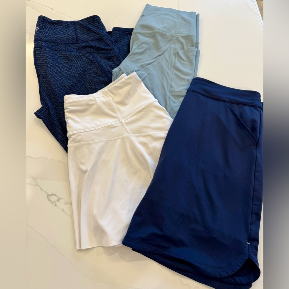 Set of 4 Athleta leggings and tennis skort + Peter Millar golf skirt size Large